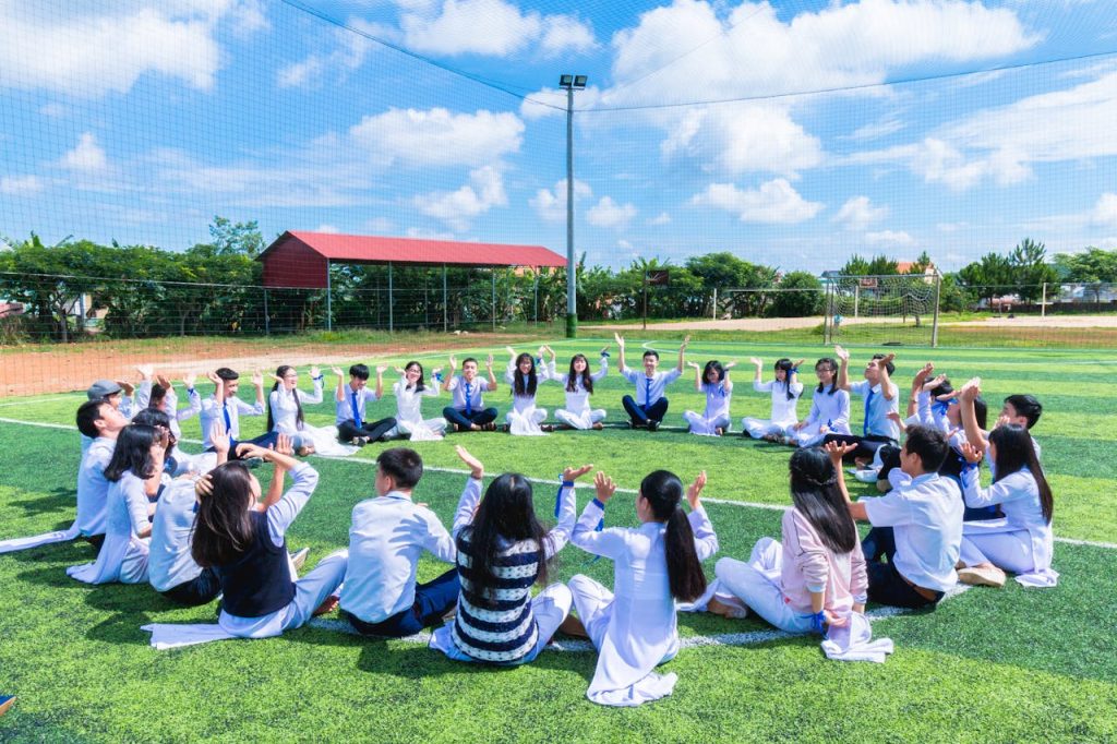 middle schoolers sitting in a circle for a field day for school fundraising ideas