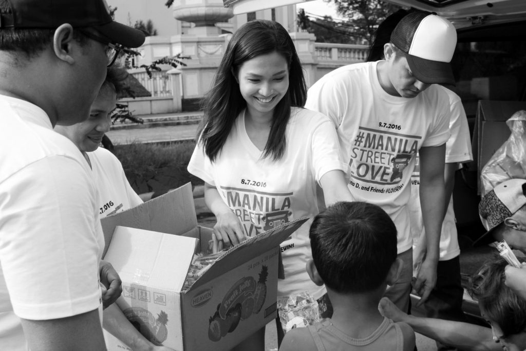 Volunteers passing out food to the hungry.