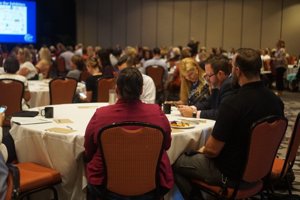 Full nonprofit conference tables at a regional AFP conference