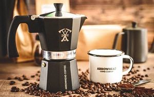 Picture of coffee mug and pour over coffee pot from a coffee subscription service