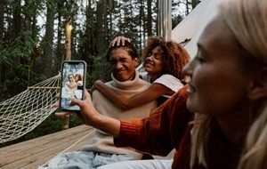 Friends taking a photo while camping