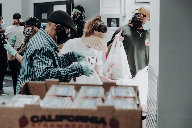 volunteers packing food donations