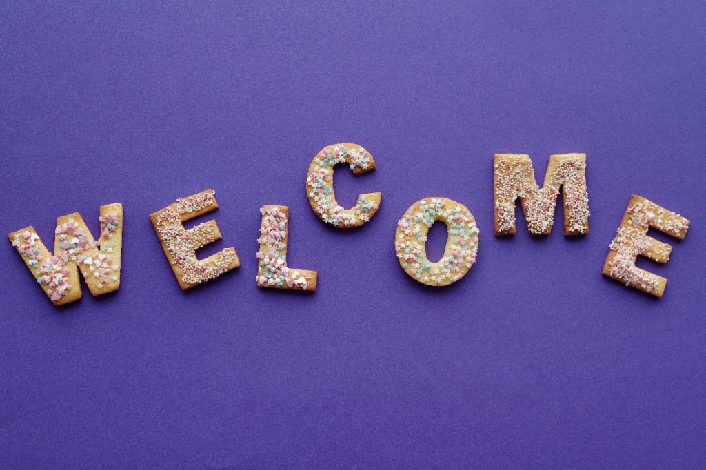 The word Welcome spelled out in cookies.