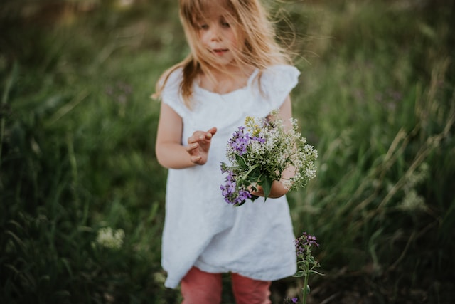 girl picking flowers for spring fundraising events