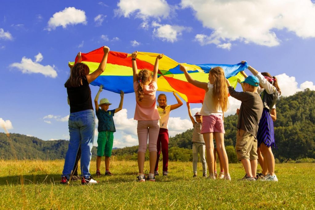 kids playing parachute for kid raffle prize ideas