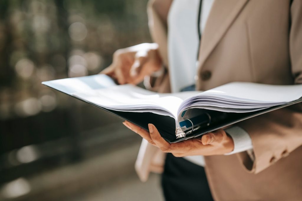 open folder with ideas for sponsorship packet template