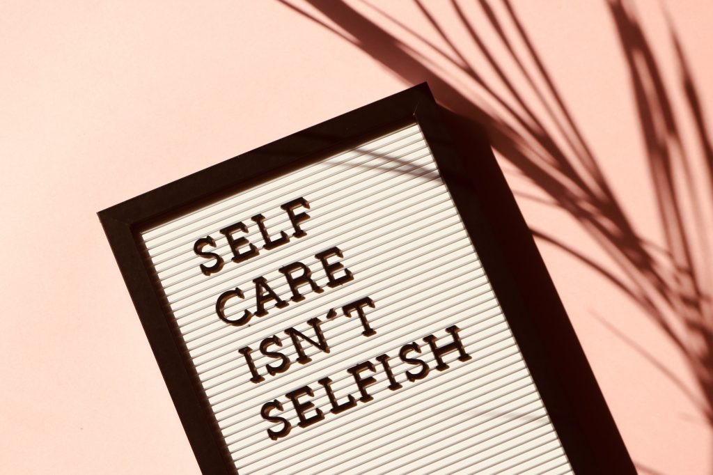 Self Care Isn't Selfish message posted on a marquee.