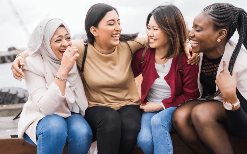 diverse group of four women celebrating human rights month