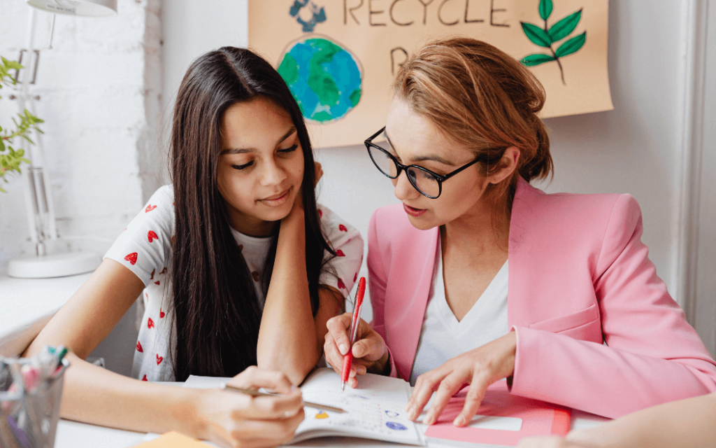 Woman mentoring young girl