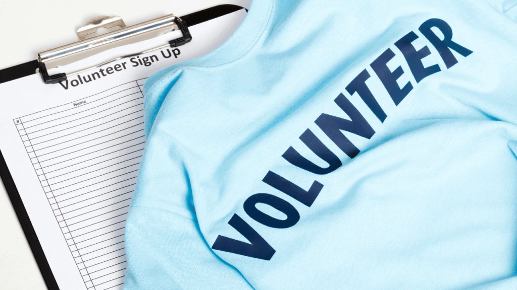 volunteer month sign up clipboard with volunteer shirt 
