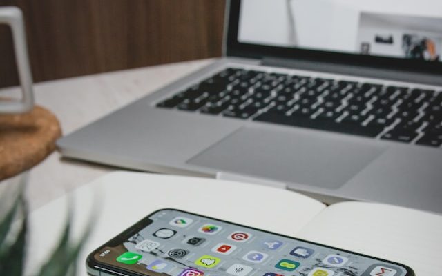 phone and laptop used in nonprofit event planning to advertise