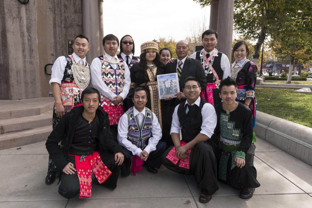 Some of the hundreds of participants at the 10th-annual Hmong New Year Celebration in downtown Chico, California, pose