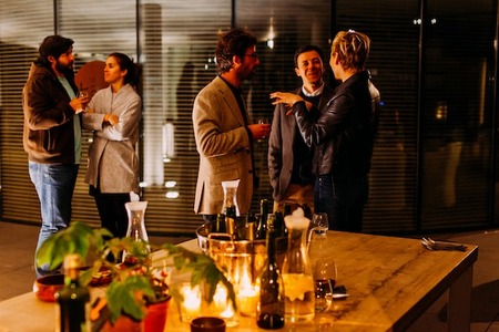 people talking indoors at a peer-to-peer fundraising event for the major gift pipeline