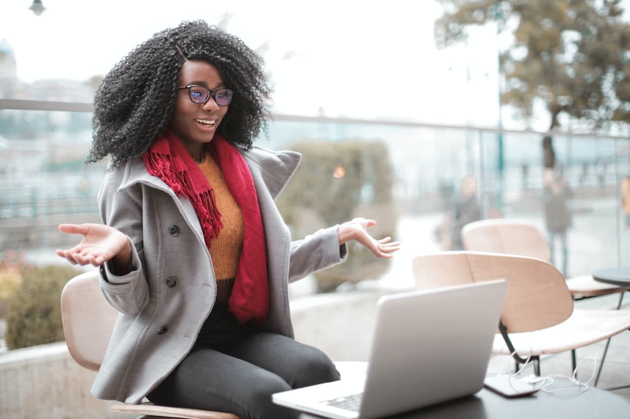 woman setting up a recurring donation on laptop computer