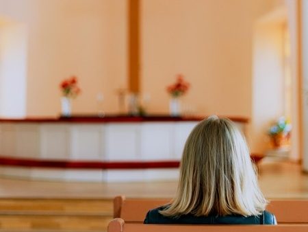 women sitting in a church waiting for a church giving auction