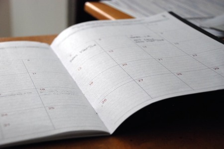 open calendar planner on a desk for end-of-year annual campaign