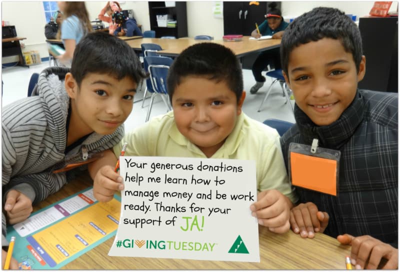 Junior Achievement follow up Giving Tuesday social post - three boys holding a thank you message for supporting JA