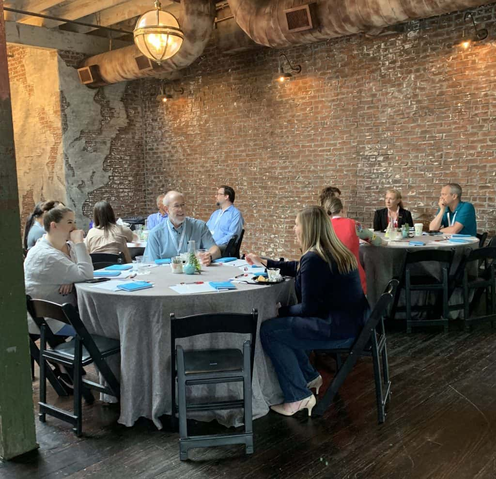 Fundraising Lab participants talking at a table