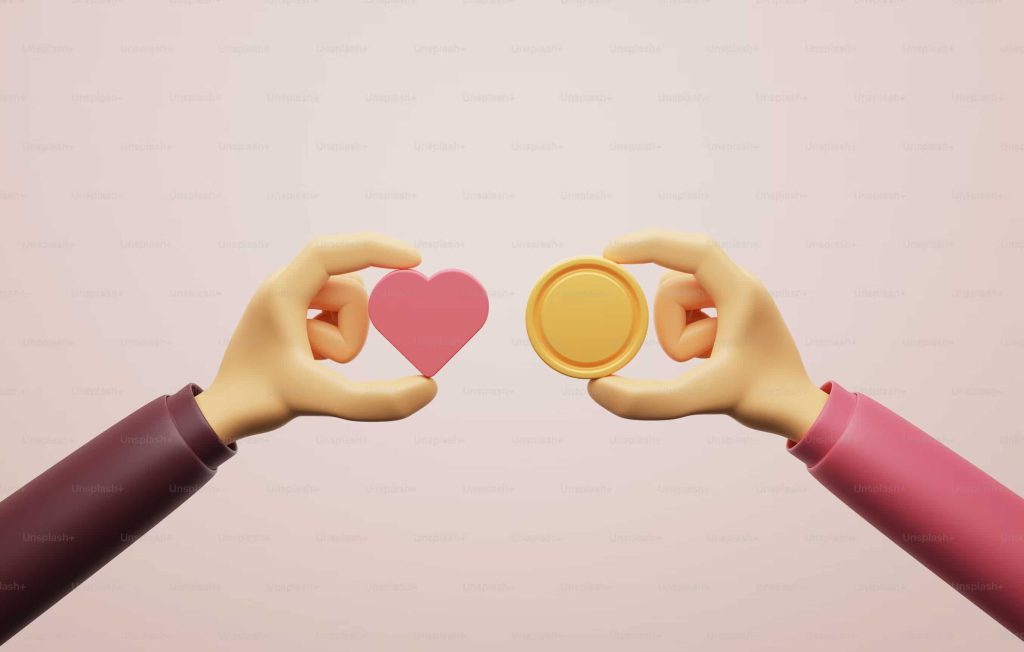 corporate giving program represented by hands holding a heart and a coin made of clay