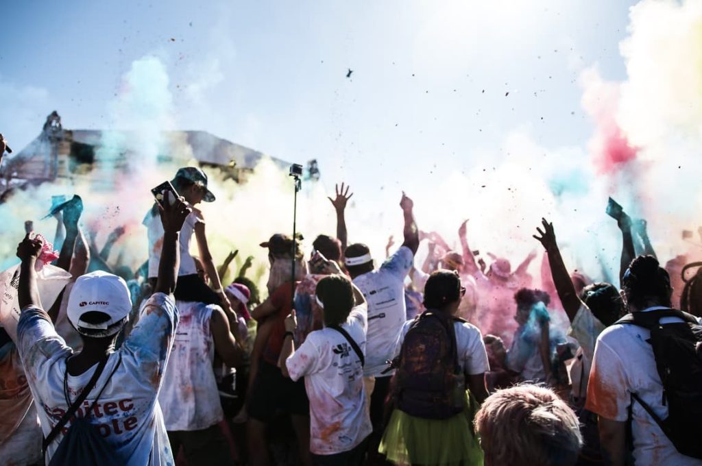 walkathon participants celebrating with color powder